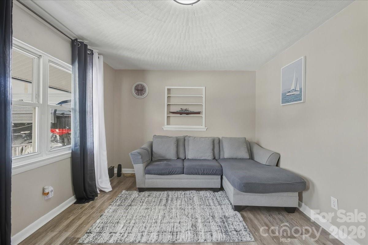 2563 Marble Street Newton, NC 28658 - Photo 12 of 40 a living room with furniture and a window