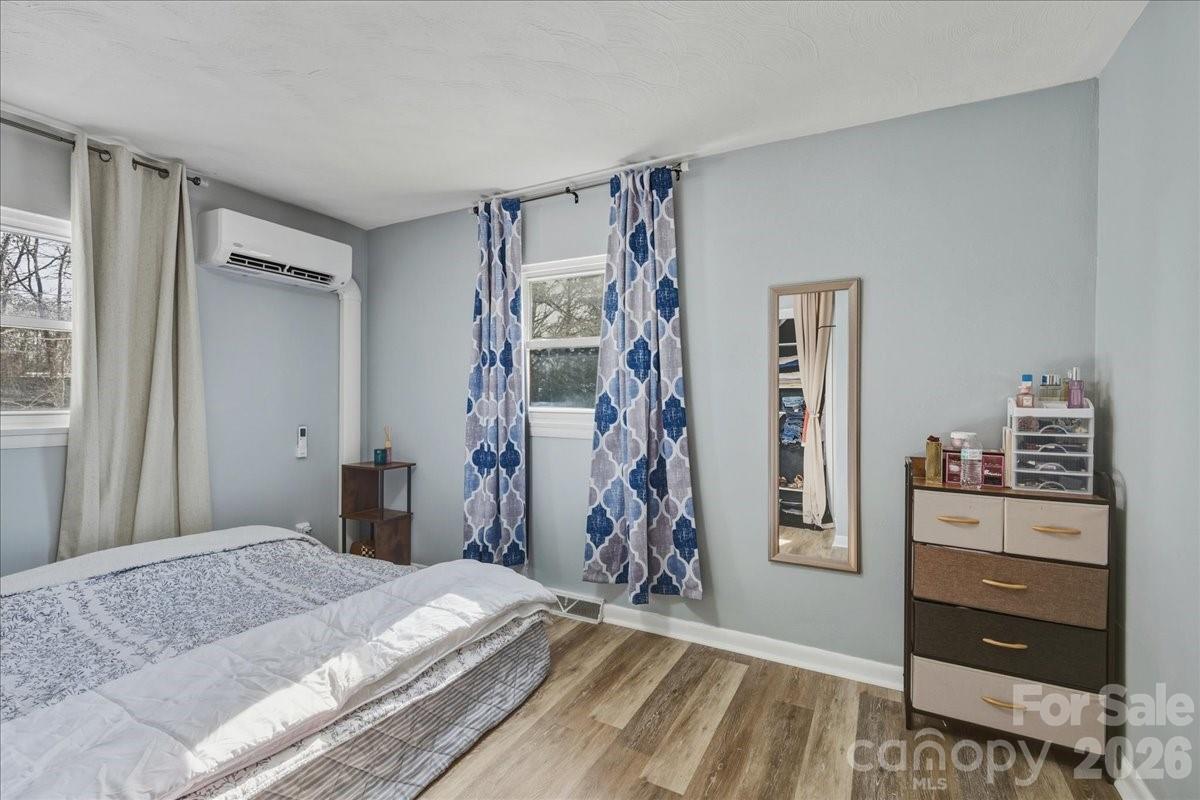 2563 Marble Street Newton, NC 28658 - Photo 21 of 40 a bedroom with a bed and a window