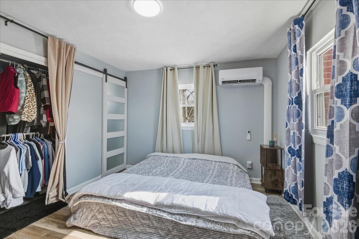 2563 Marble Street Newton, NC 28658 - Photo 22 of 40 a bedroom with a bed and a view of closet