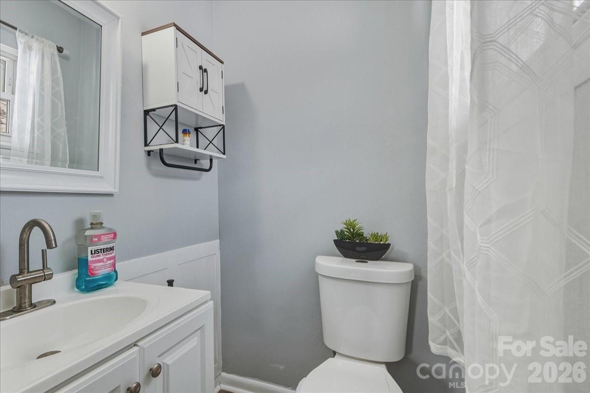 2563 Marble Street Newton, NC 28658 - Photo 23 of 40 a bathroom with a sink toilet and a mirror
