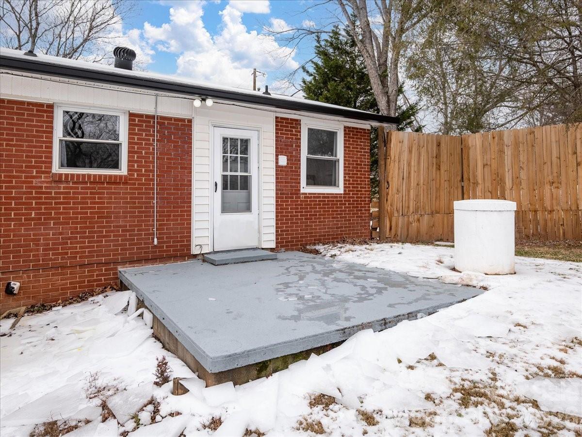 2563 Marble Street Newton, NC 28658 - Photo 32 of 40 a backyard of a house with a tree