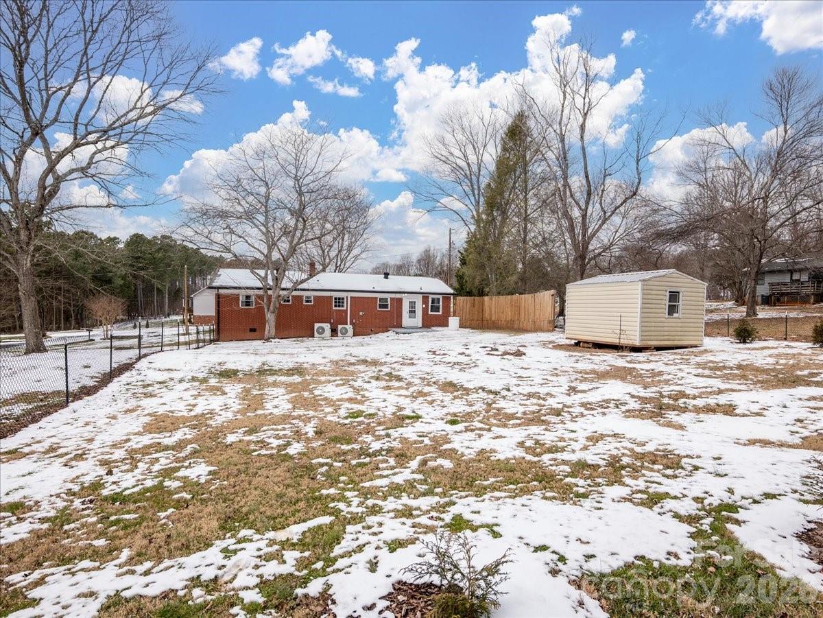 2563 Marble Street Newton, NC 28658 - Photo 34 of 40 a front view of a house with a yard covered in snow
