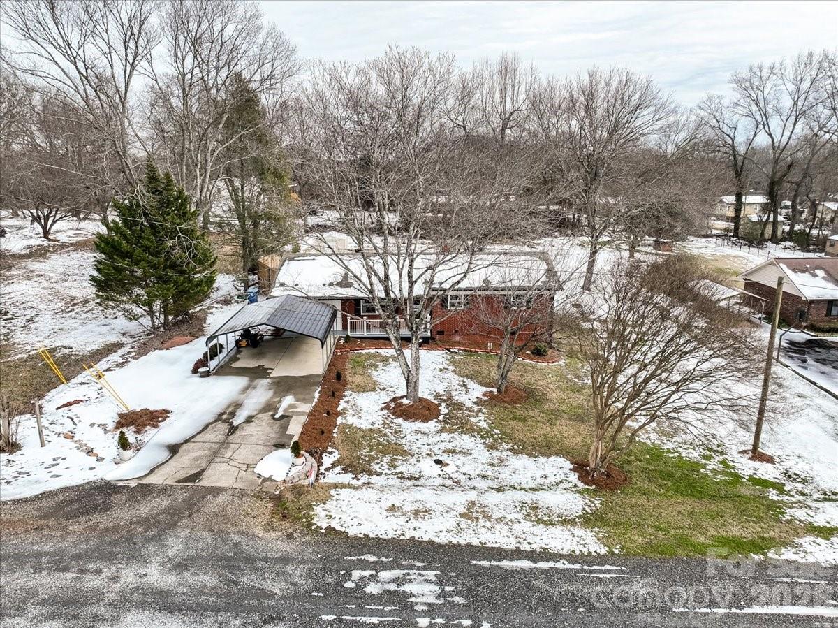 2563 Marble Street Newton, NC 28658 - Photo 6 of 40 a view of yard covered with snow in front of house