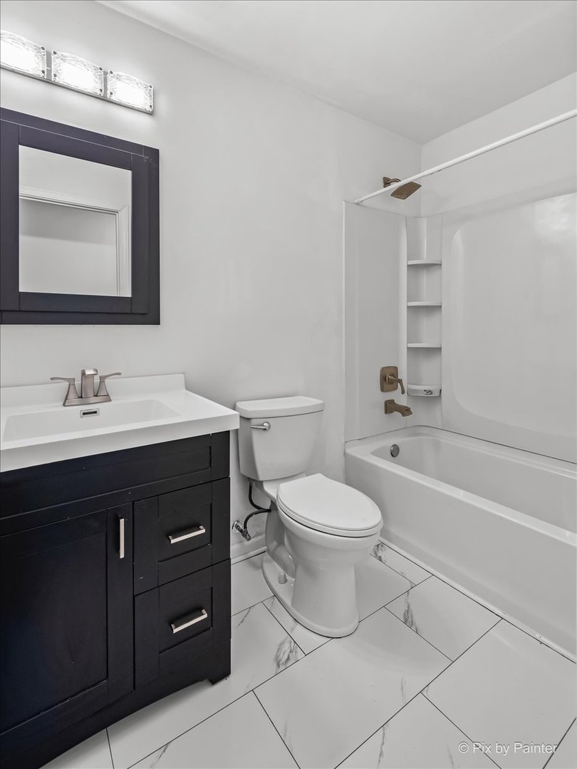 3 Deerpath Road Lake In The Hills, IL 60156 - Photo 11 of 27 a bathroom with a sink a toilet and shower
