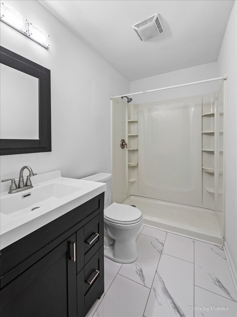 3 Deerpath Road Lake In The Hills, IL 60156 - Photo 14 of 27 a bathroom with a sink a toilet and shower
