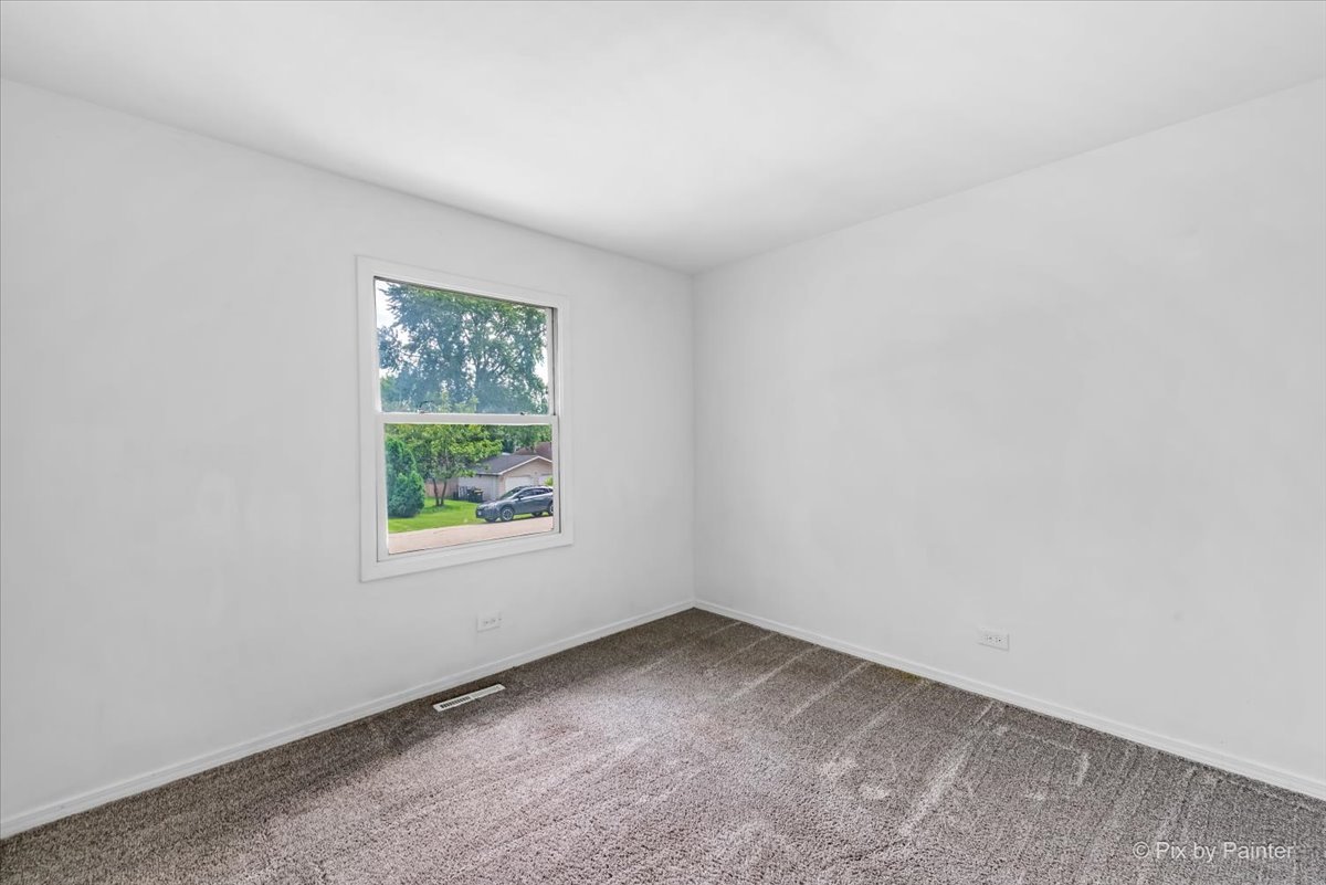 3 Deerpath Road Lake In The Hills, IL 60156 - Photo 15 of 27 an empty room with a window