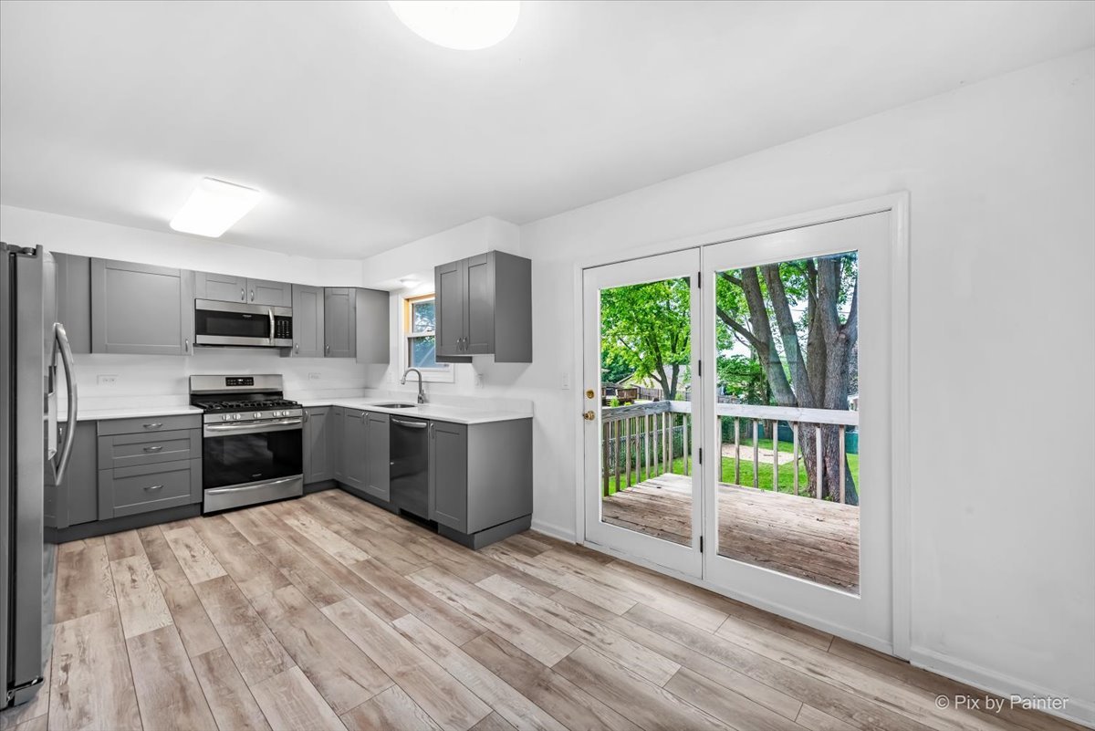 3 Deerpath Road Lake In The Hills, IL 60156 - Photo 5 of 27 a kitchen with stainless steel appliances a refrigerator a sink dishwasher stove and oven