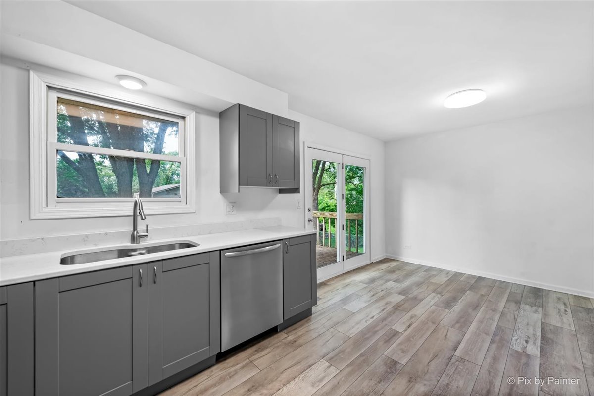 3 Deerpath Road Lake In The Hills, IL 60156 - Photo 10 of 27 a kitchen with a sink and large window