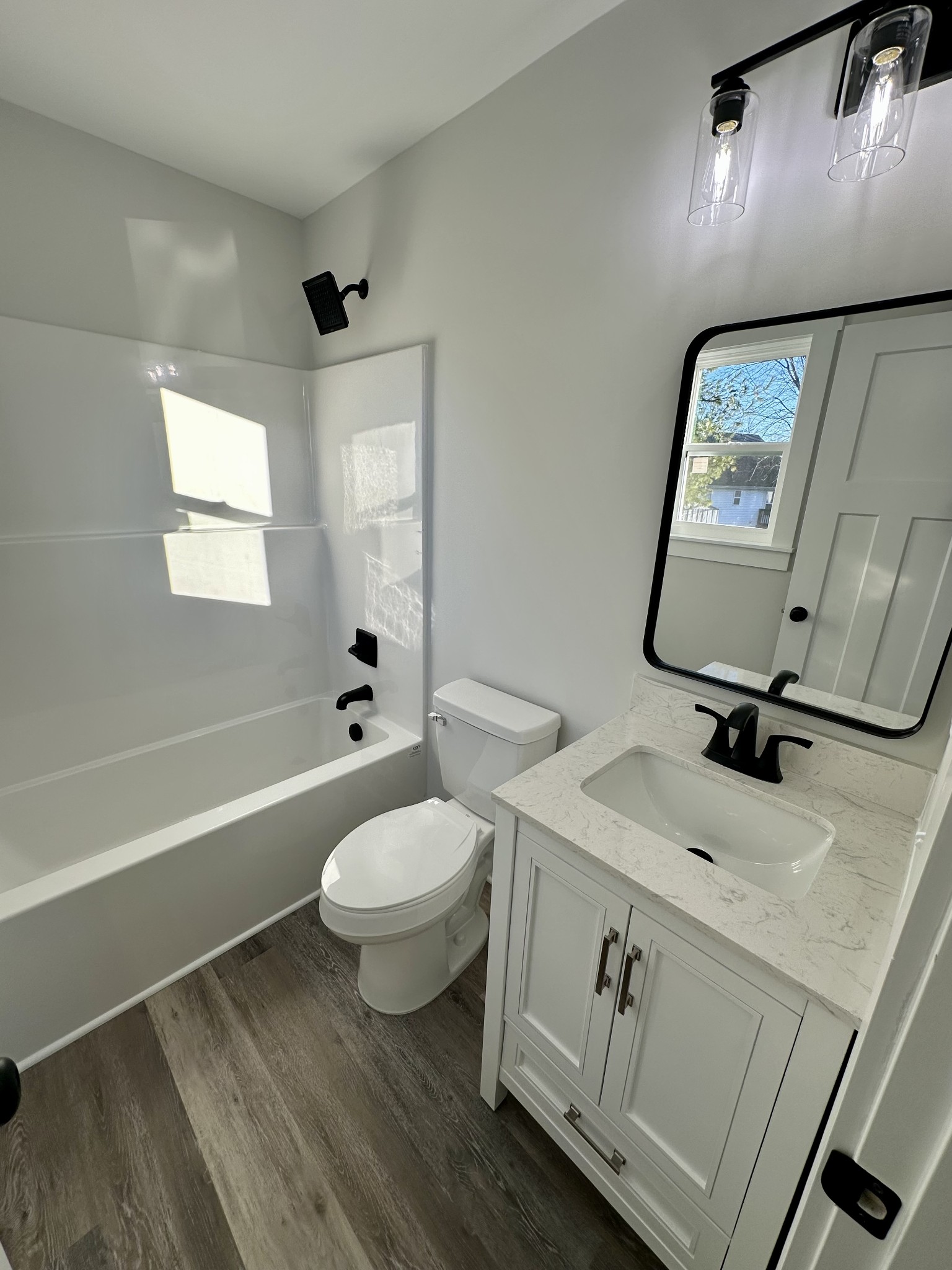 208 Derek Court Portland, TN 37148 - Photo 16 of 27 a bathroom with a toilet a sink and mirror