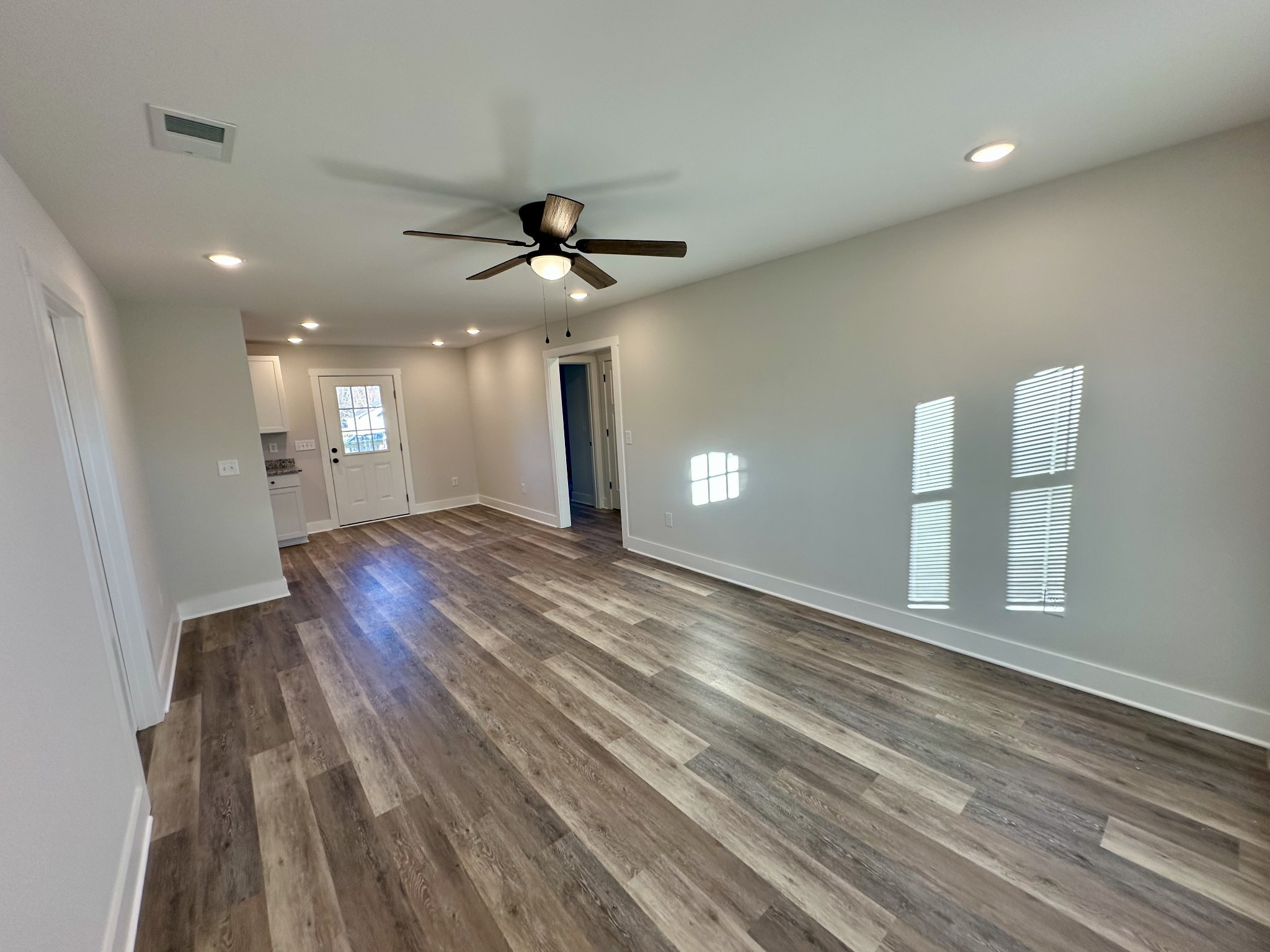 208 Derek Court Portland, TN 37148 - Photo 3 of 27 a view of empty room with wooden floor and fan