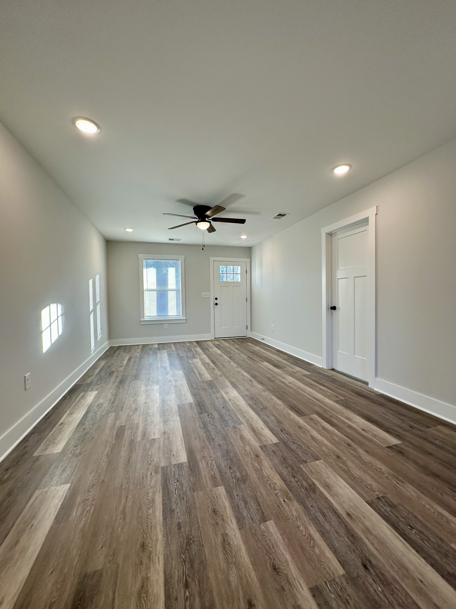 208 Derek Court Portland, TN 37148 - Photo 4 of 27 a view of empty room with wooden floor and fan