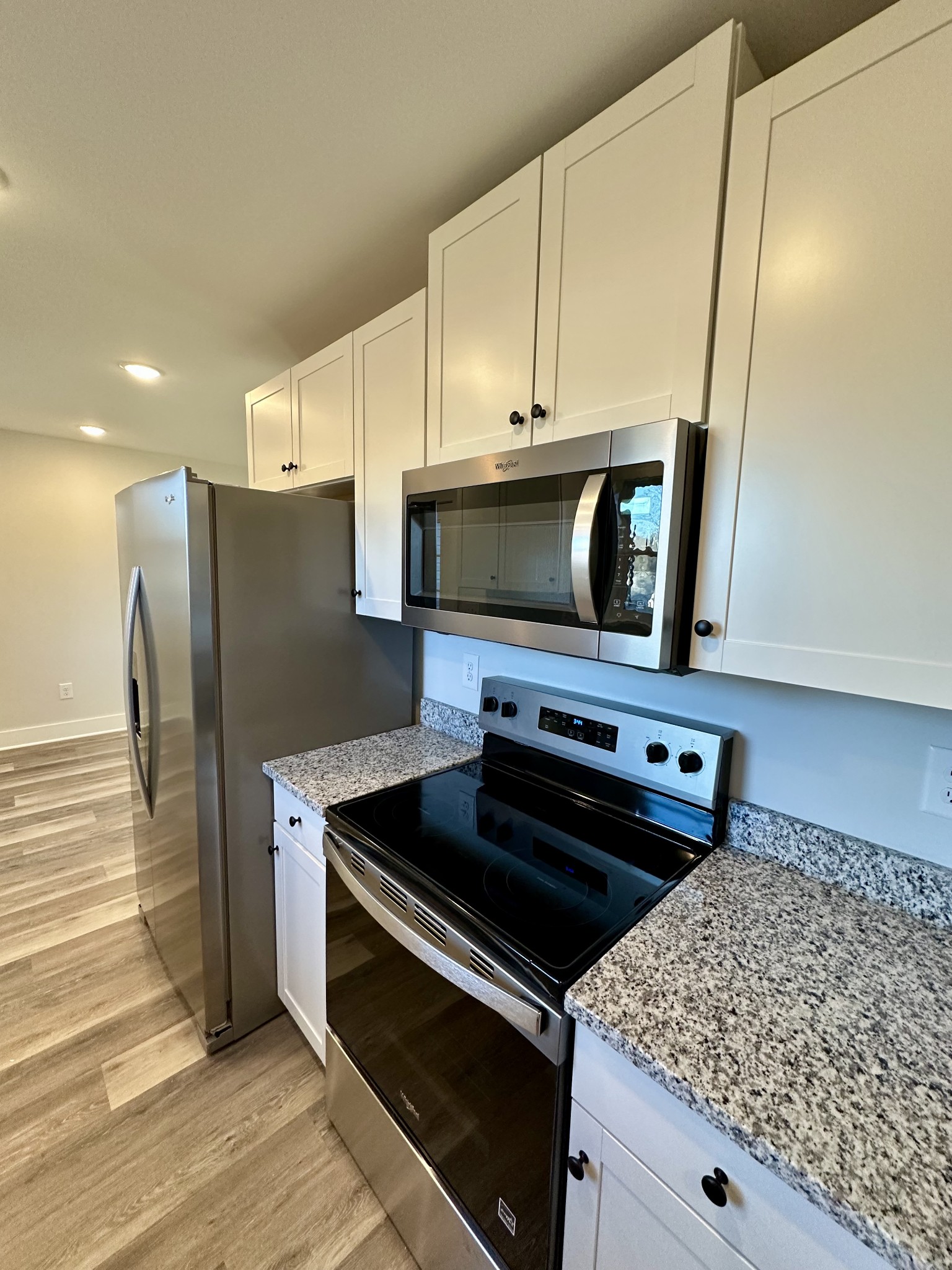 208 Derek Court Portland, TN 37148 - Photo 8 of 27 a kitchen with a stove and a microwave