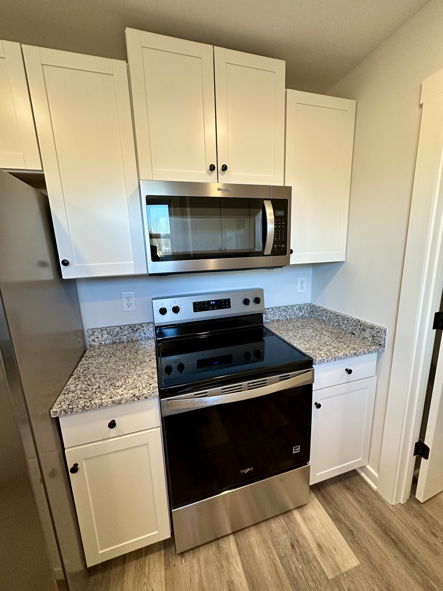 208 Derek Court Portland, TN 37148 - Photo 9 of 27 a kitchen with a stove microwave and sink
