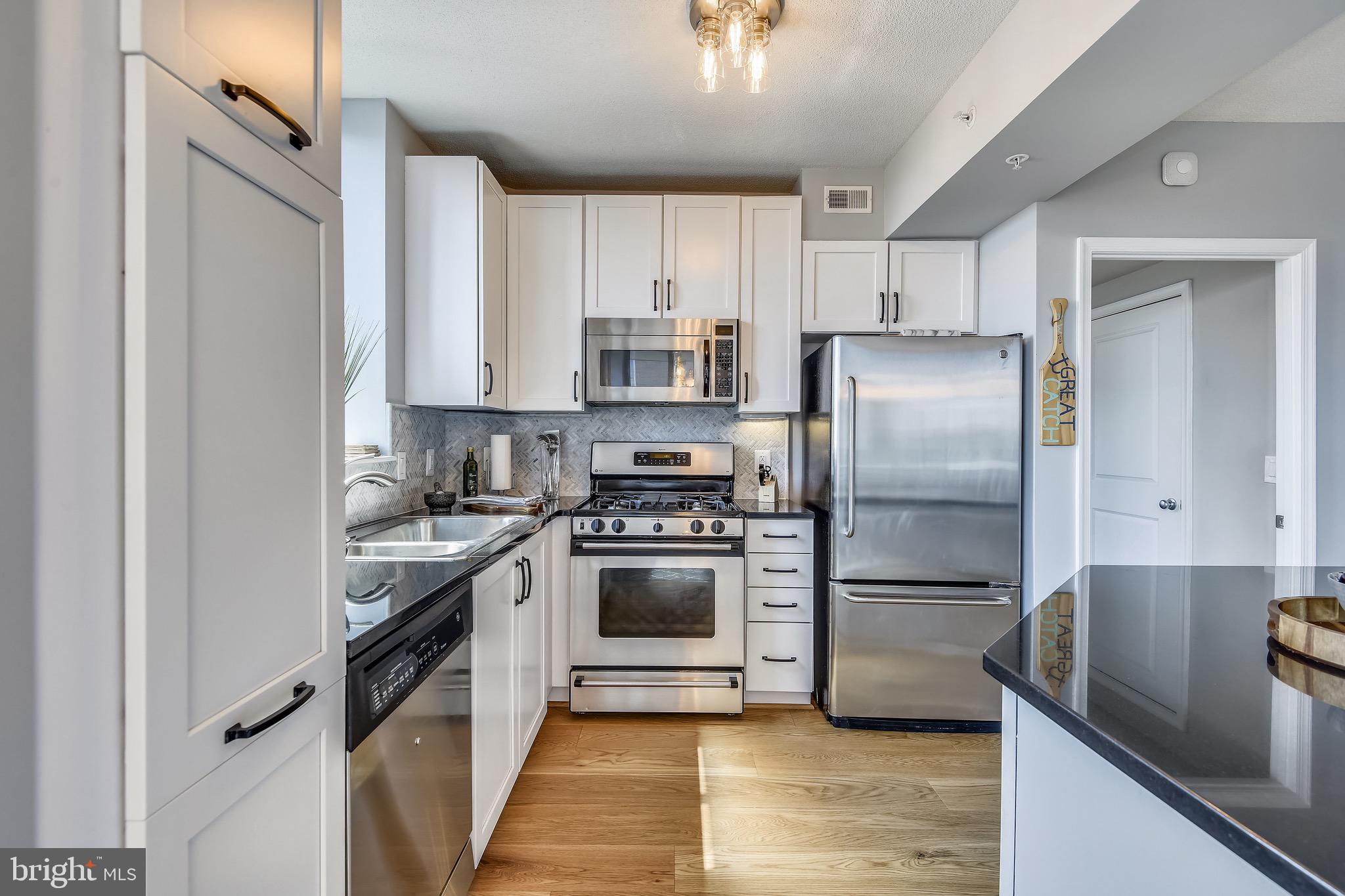851 North Glebe Road, Unit 1505 Arlington, VA 22203 - Photo 9 of 85 Kitchen w/ Stainless Steel Appliances and Granite