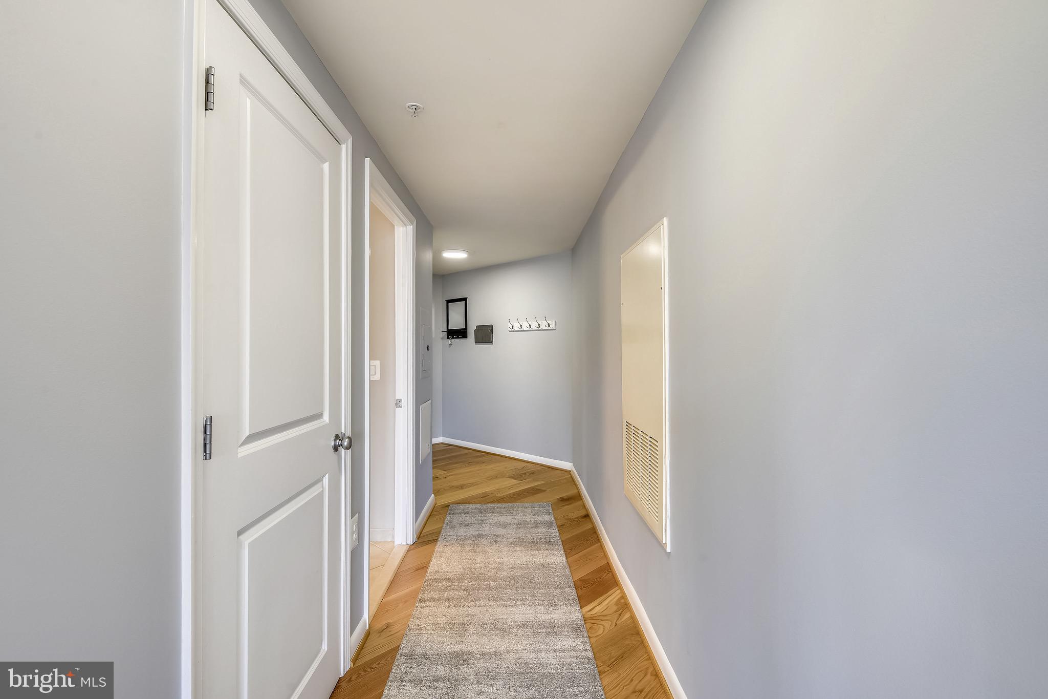 851 North Glebe Road, Unit 1505 Arlington, VA 22203 - Photo 2 of 85 Hallway w/ Laundry Closet