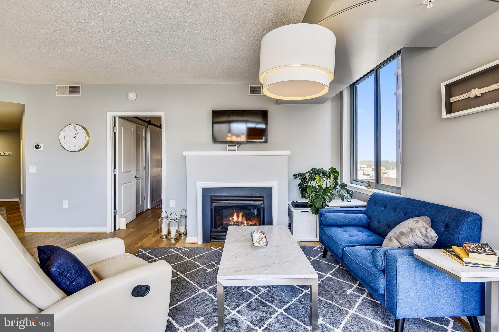 851 North Glebe Road, Unit 1505 Arlington, VA 22203 - Photo 5 of 85 Living Room w/ Gas Fireplace and Hardwood Flooring