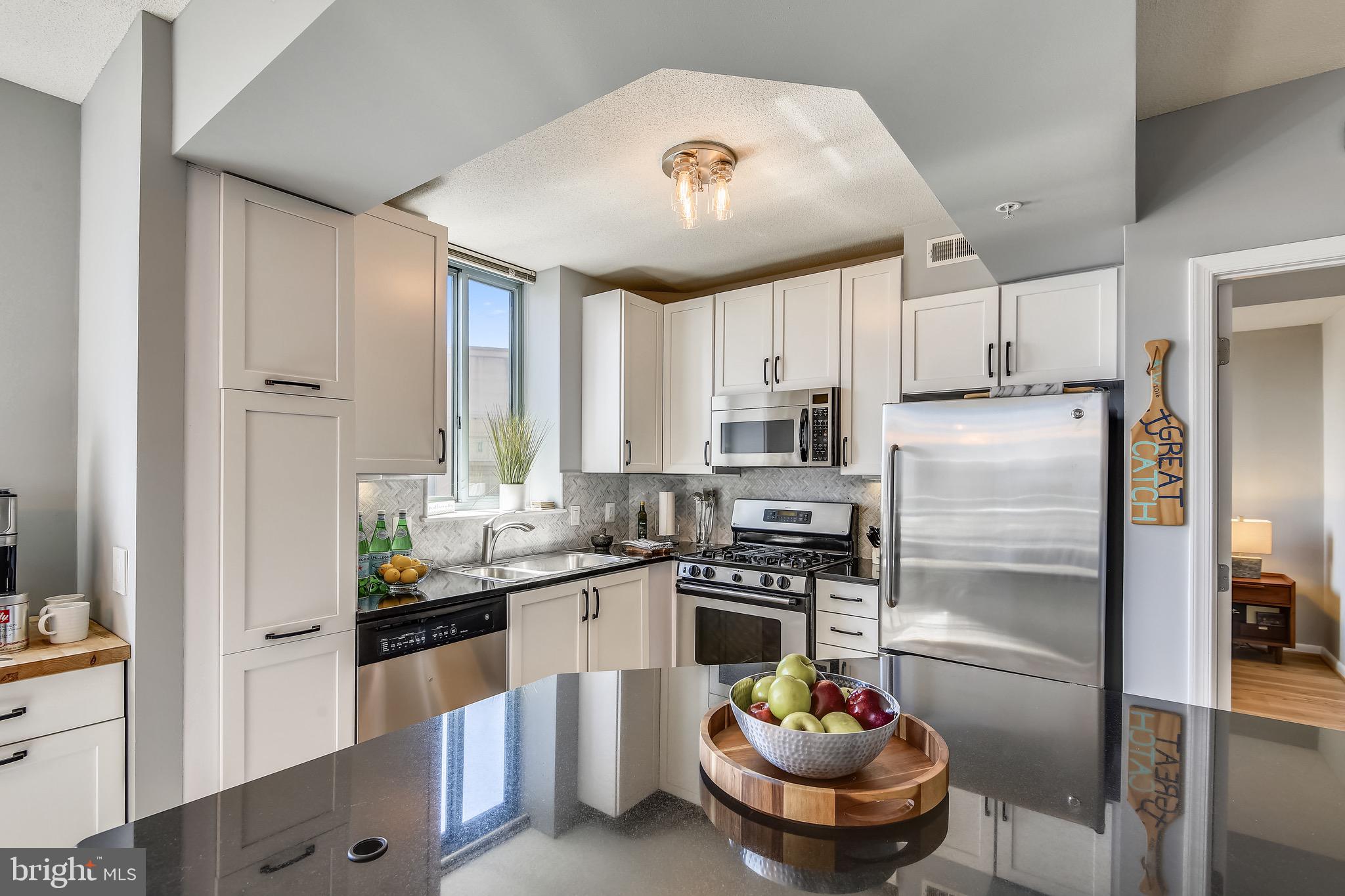 851 North Glebe Road, Unit 1505 Arlington, VA 22203 - Photo 7 of 85 Kitchen w/ White Shaker Style Cabinetry