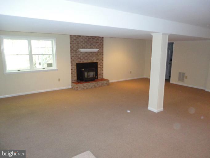 1228 Nottingham Road Westminster, MD 21157 - Photo 3 of 29 Lower Level Family Rm w Brick Fireplace