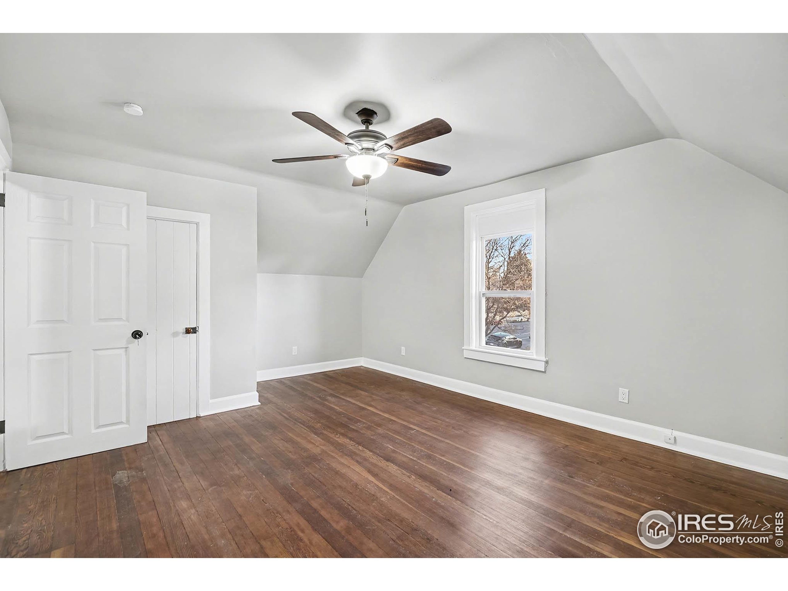 1330 8th Street Greeley, CO 80631 - Photo 16 of 27 a view of an empty room with a ceiling fan