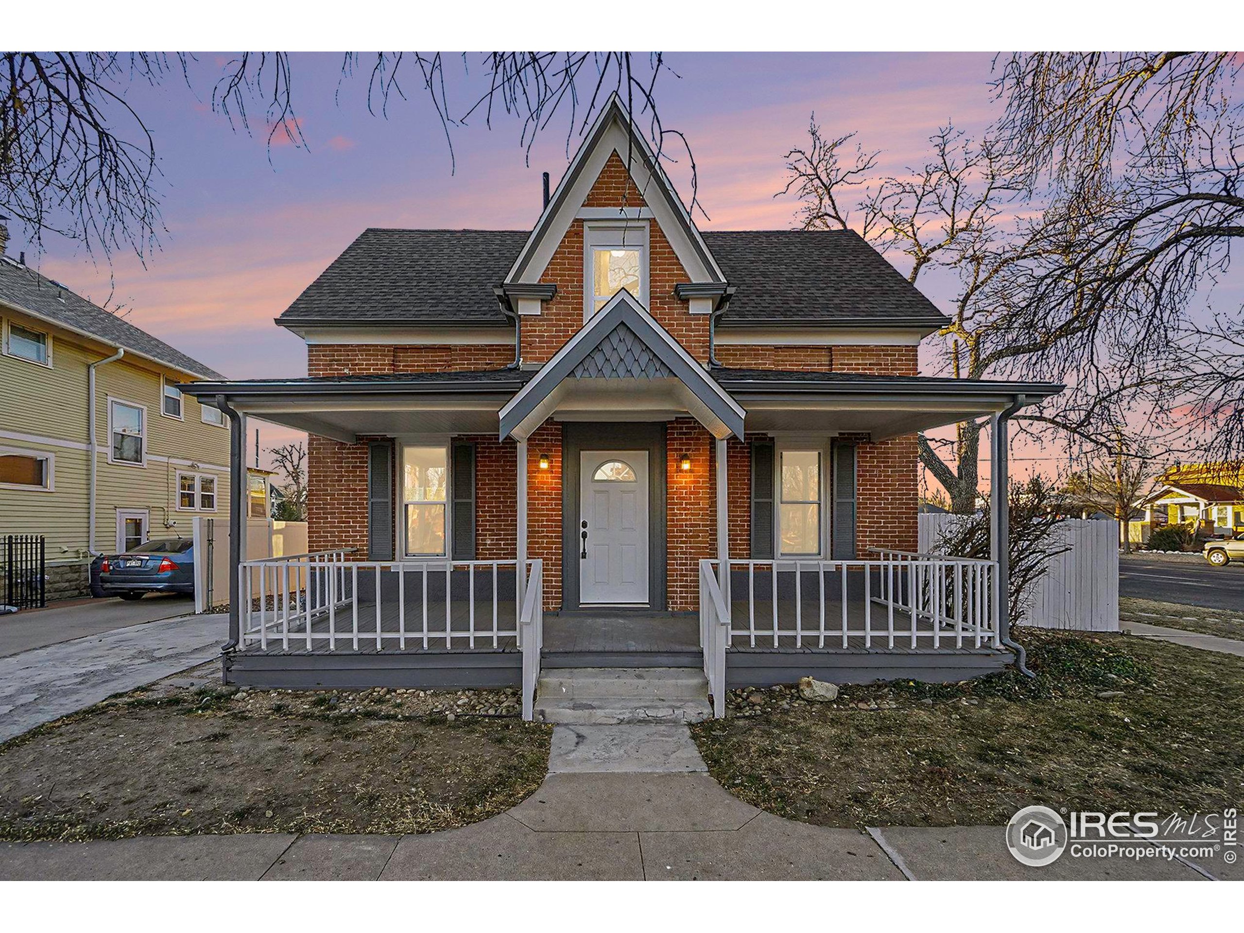 1330 8th Street Greeley, CO 80631 - Photo 2 of 27 a front view of a house with garden