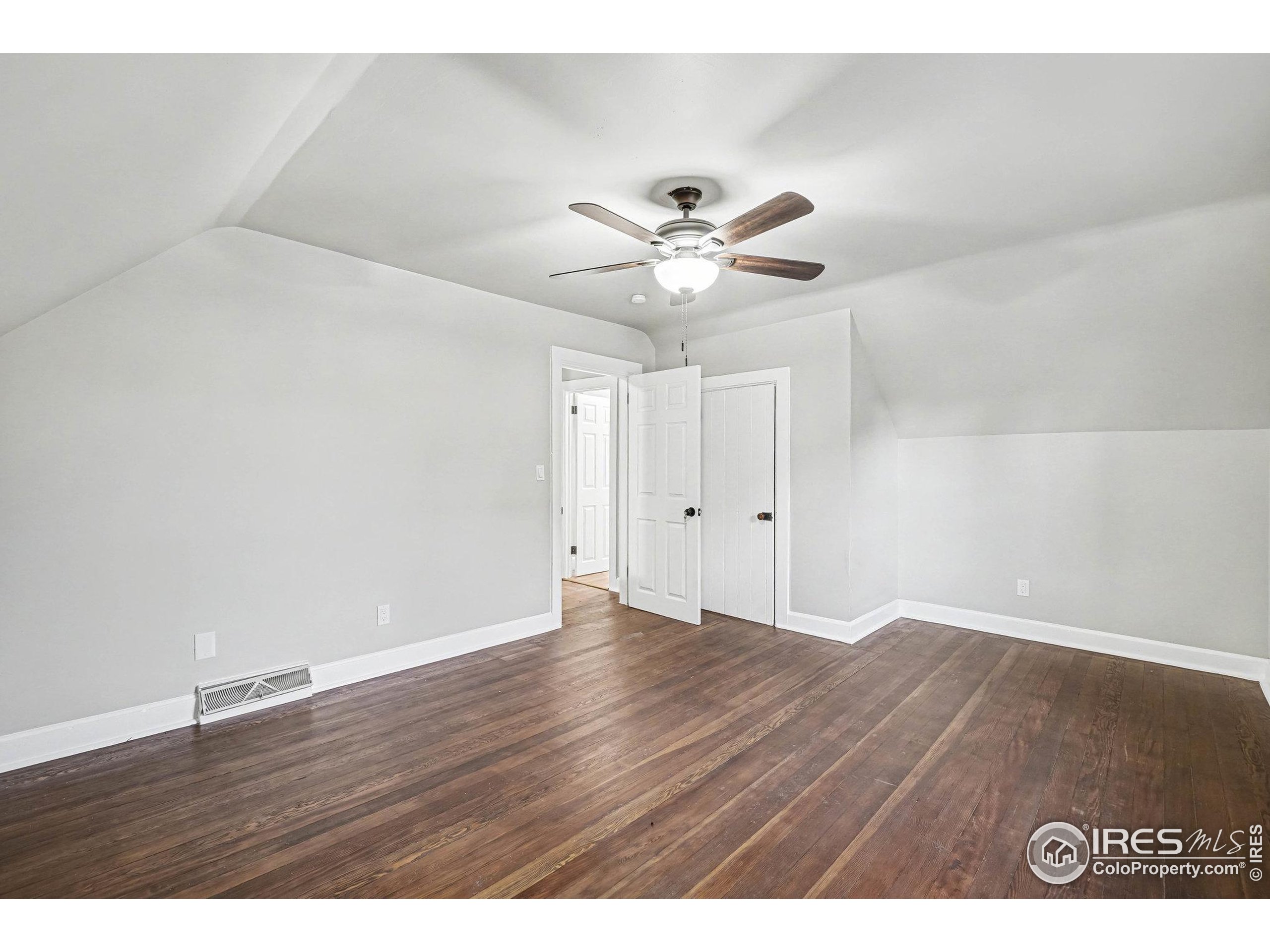1330 8th Street Greeley, CO 80631 - Photo 24 of 27 a view of an empty room with wooden floor