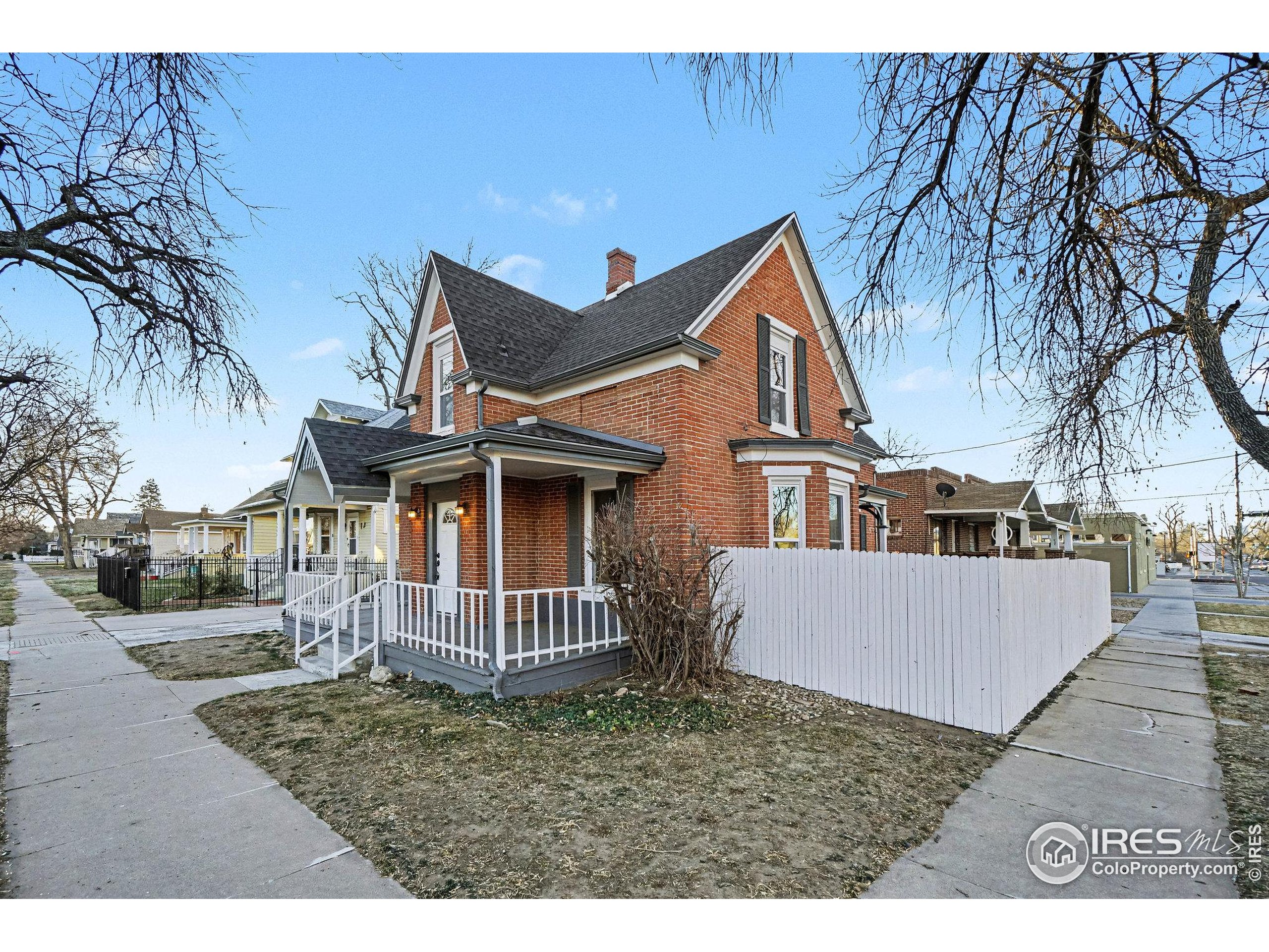 1330 8th Street Greeley, CO 80631 - Photo 5 of 27 front view of a house with a yard