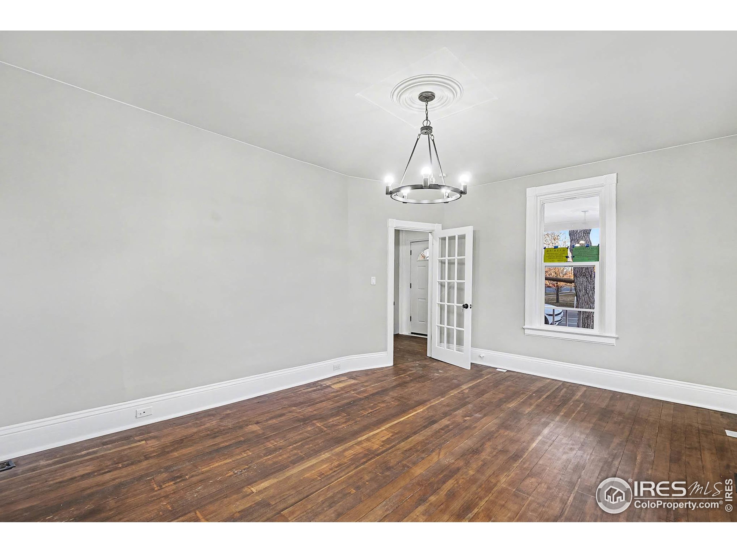 1330 8th Street Greeley, CO 80631 - Photo 7 of 27 a view of a livingroom with wooden floor
