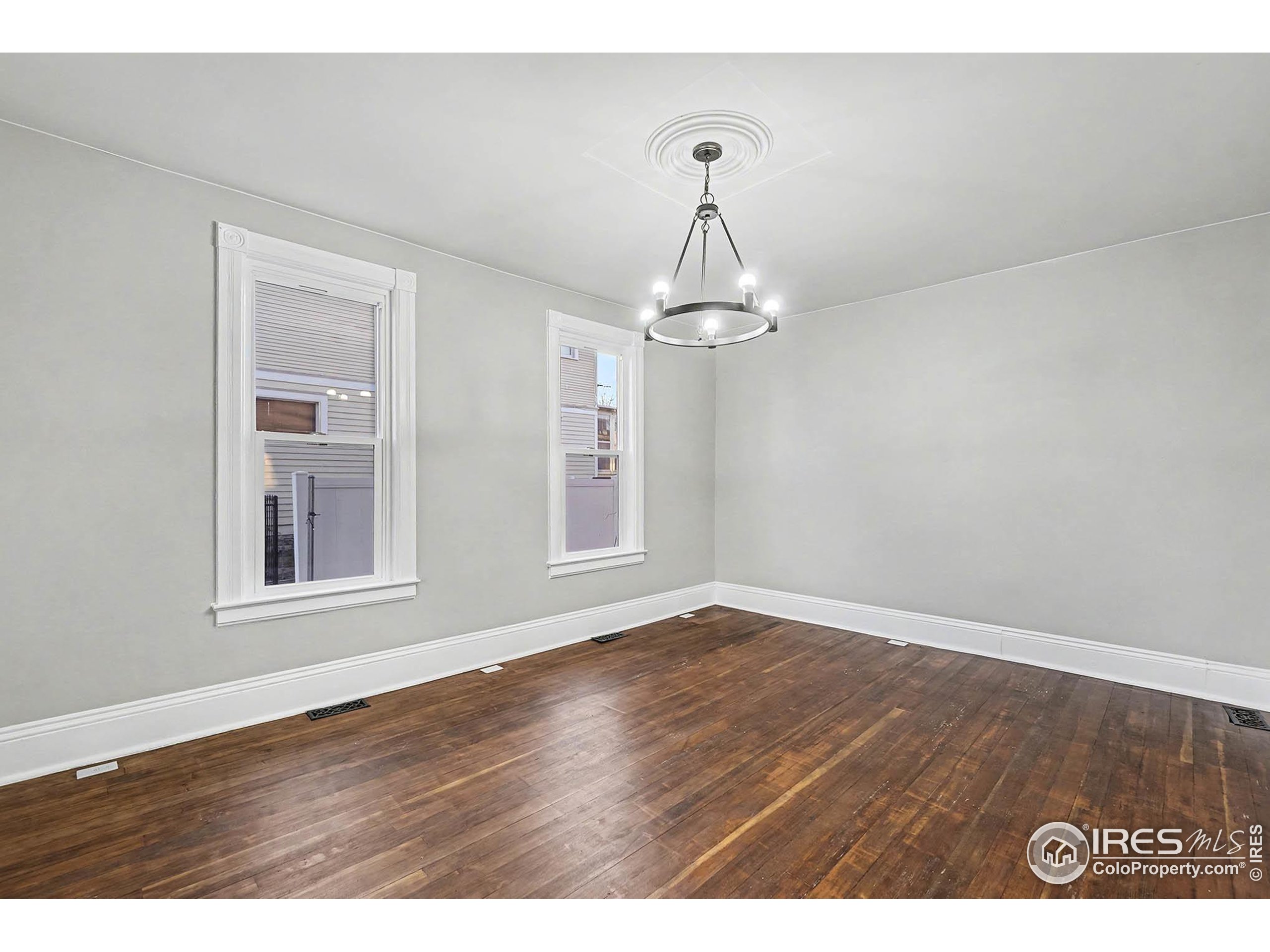 1330 8th Street Greeley, CO 80631 - Photo 8 of 27 a view of empty room with wooden floor