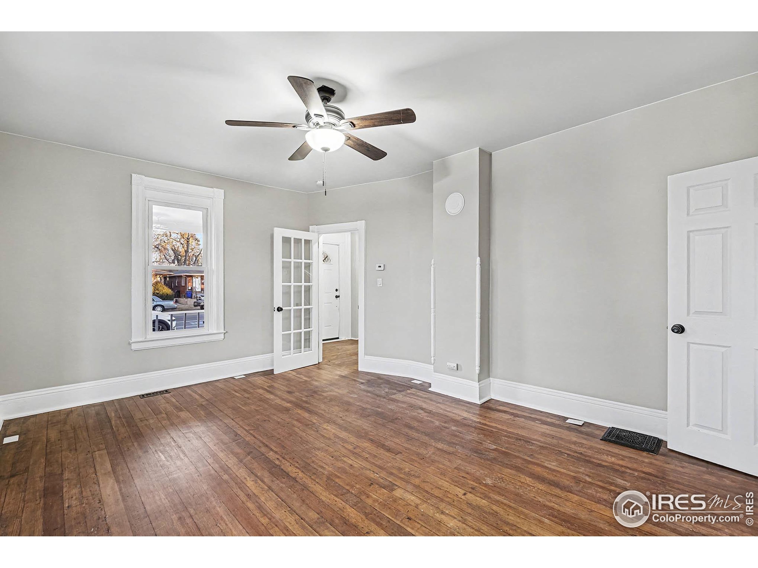 1330 8th Street Greeley, CO 80631 - Photo 10 of 27 a view of an empty room with wooden floor