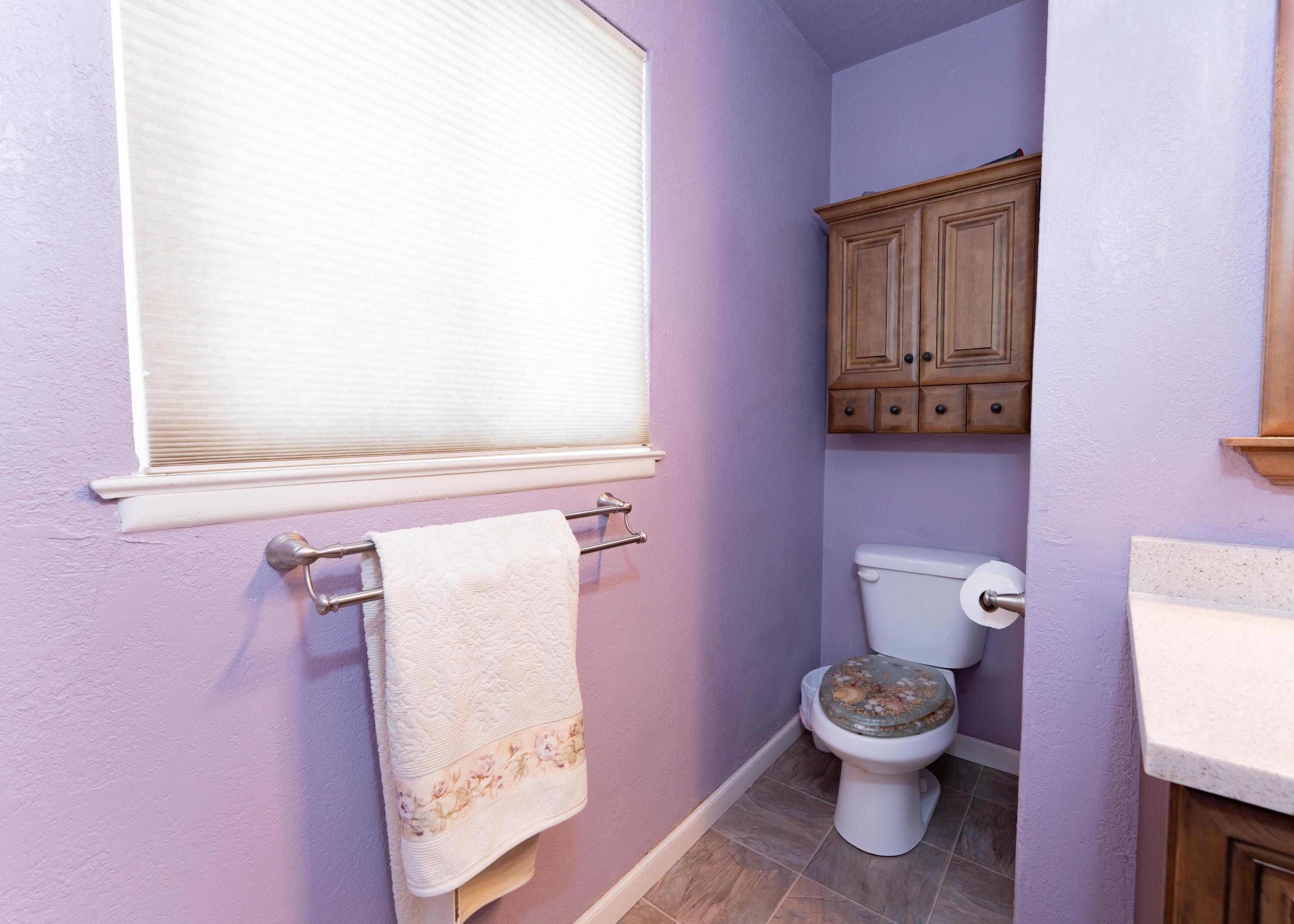 570 North Birch Avenue Reedley, CA 93654 - Photo 36 of 52 a white toilet sitting next to a bathroom sink