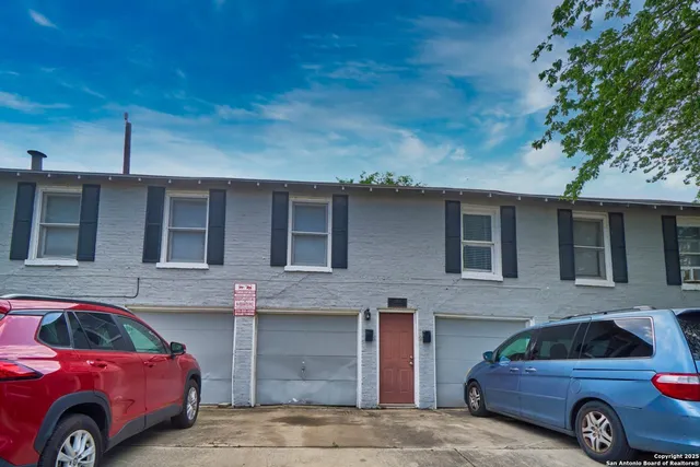 a front view of a house with parking space