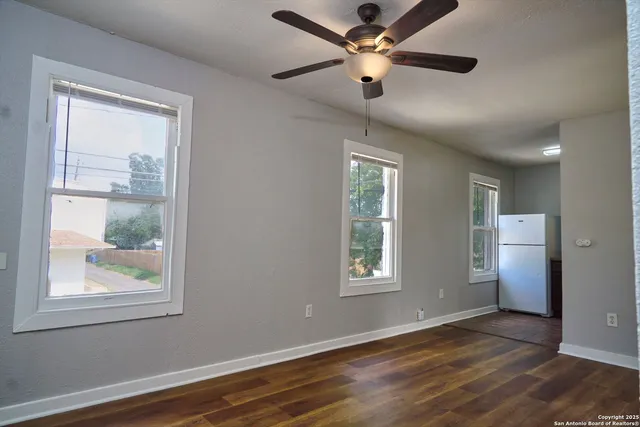 a view of a kitchen with a sink and stainless steel appliances