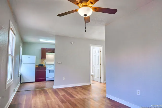a view of an empty room with a window