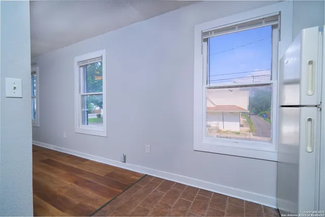 a kitchen with a sink and a refrigerator