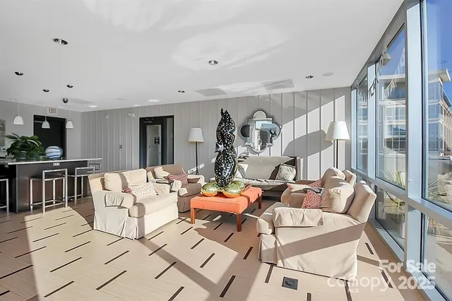 a living room with fireplace furniture and a table