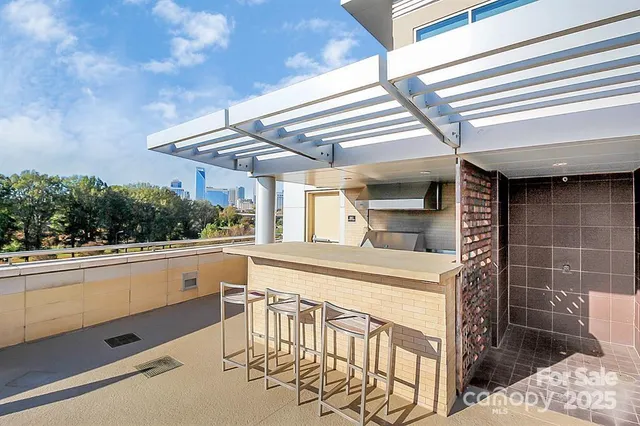 a view of a kitchen with a sink and cabinets