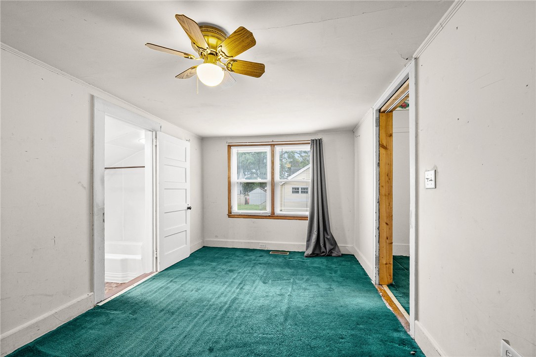 47 Square Street Pelzer, SC 29669 - Photo 16 of 29 A spacious flex room with classic carpet flooring enjoys easy access to the adjacent bathroom.