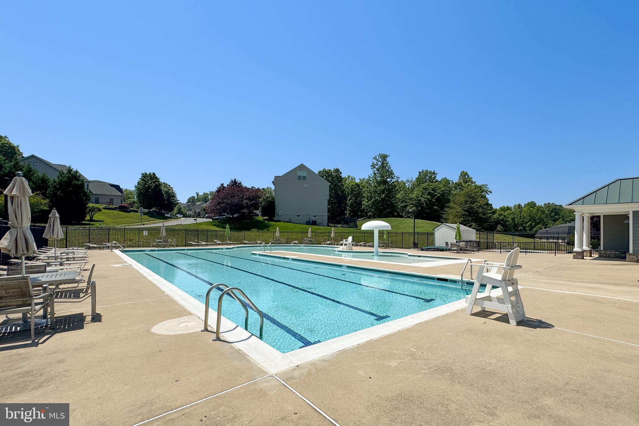 18475 Kerill Road Triangle, VA 22172 - Photo 98 of 99 a view of a swimming pool with a lounge chair