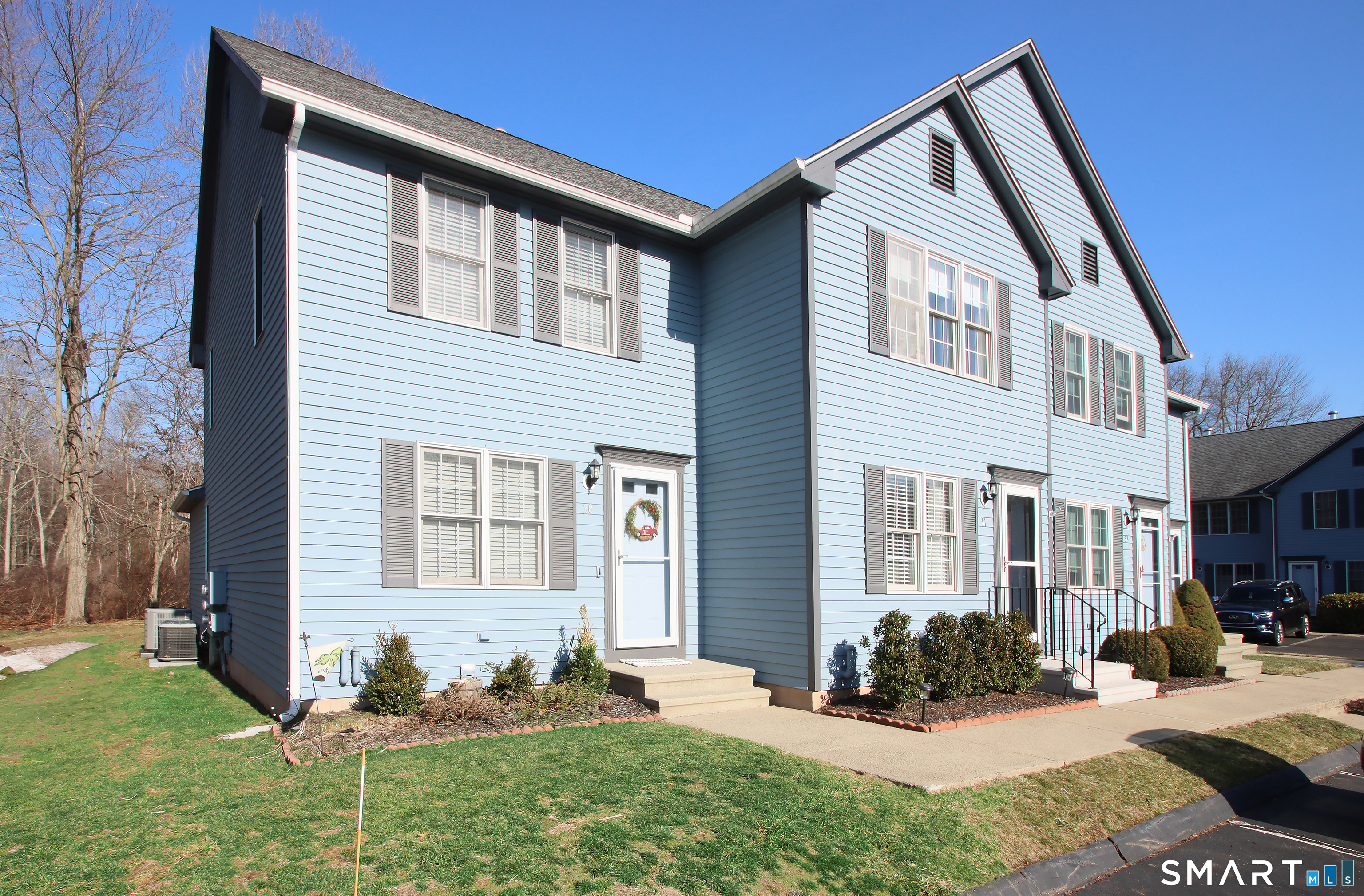 30 Mallard Court, Unit 30 Wallingford, CT 06492 - Photo 1 of 1 a front view of a house with a yard