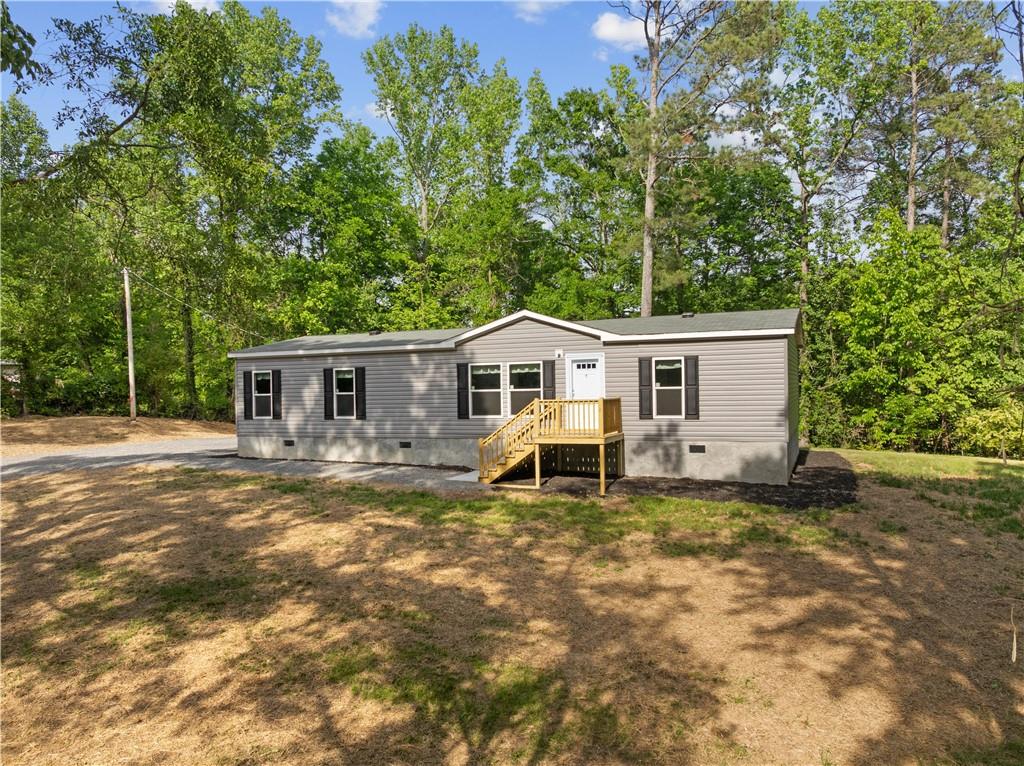 120 James Street Northwest Resaca, GA 30735 - Photo 2 of 31 a front view of a house with a yard