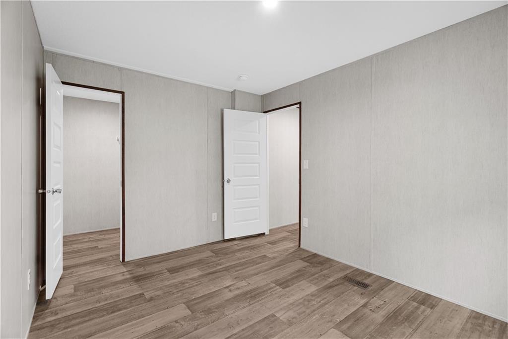 120 James Street Northwest Resaca, GA 30735 - Photo 23 of 31 a view of an empty room with wooden floor and closet