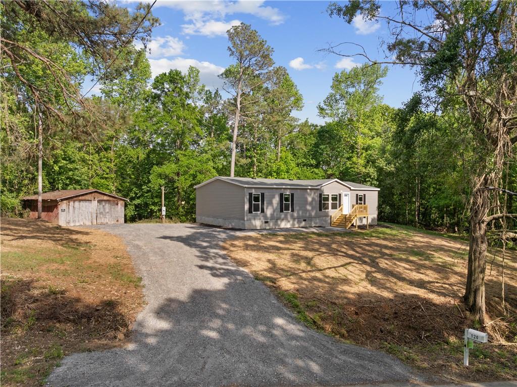 120 James Street Northwest Resaca, GA 30735 - Photo 28 of 31 a view of a house with backyard and trees