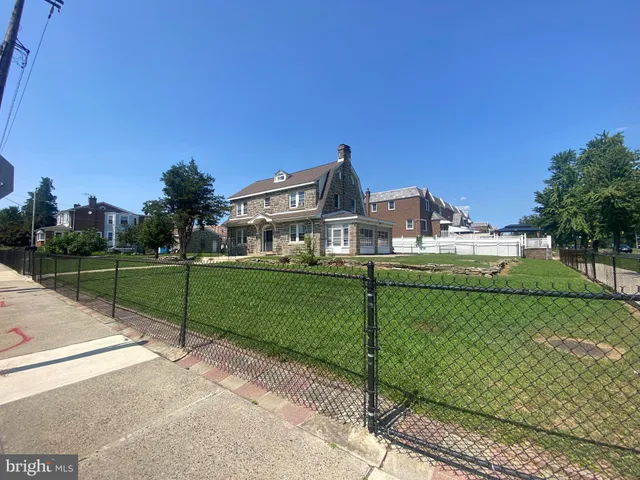 a view of a park with large trees