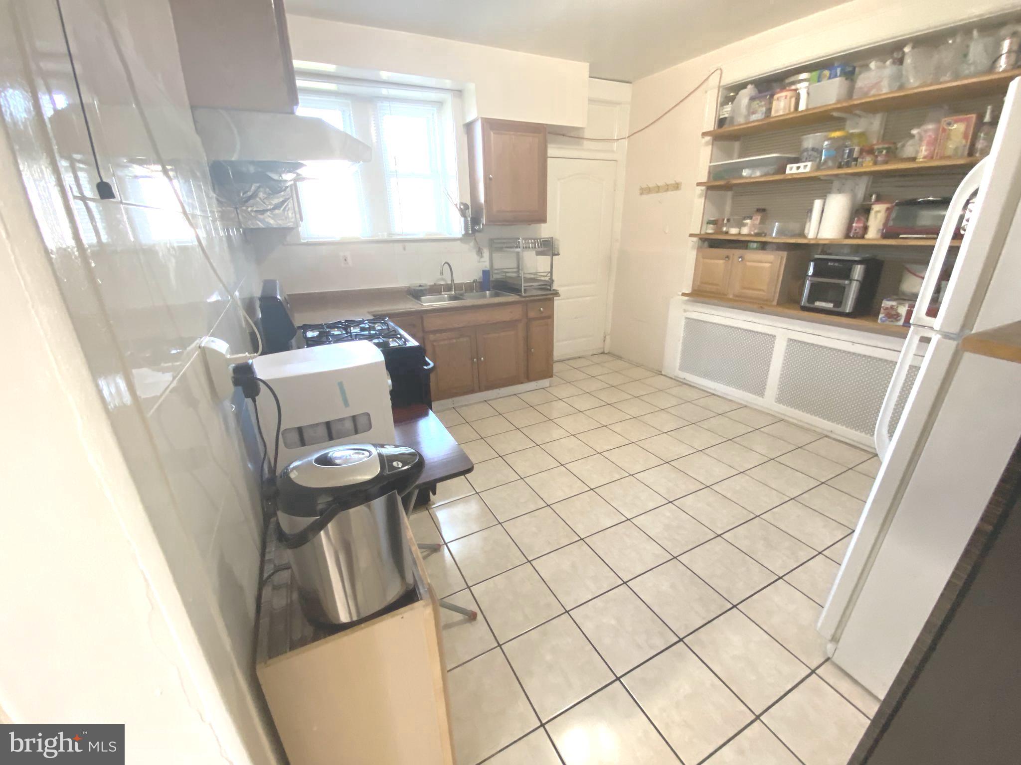2249 Knorr Street Philadelphia, PA 19149 - Photo 23 of 40 a living room with a couch and a table