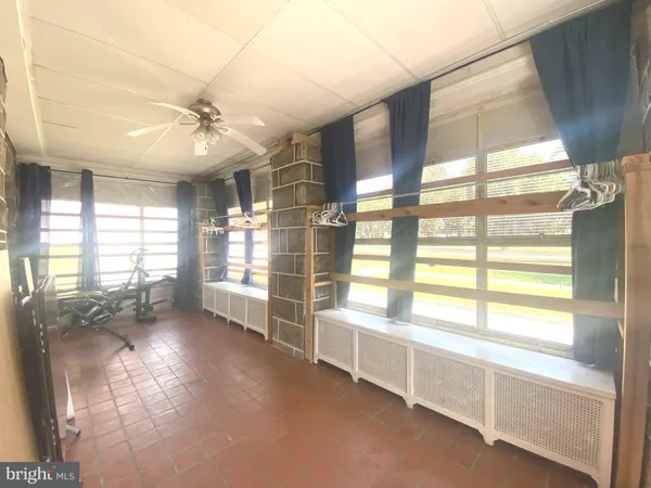 a room with window and cabinet