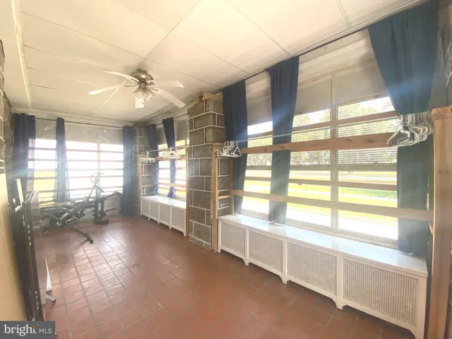 a room with window and cabinet