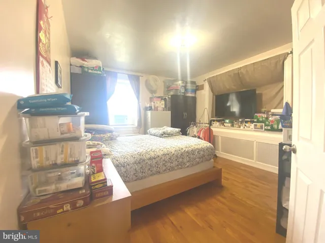 a bathroom with a granite countertop toilet a sink and a mirror