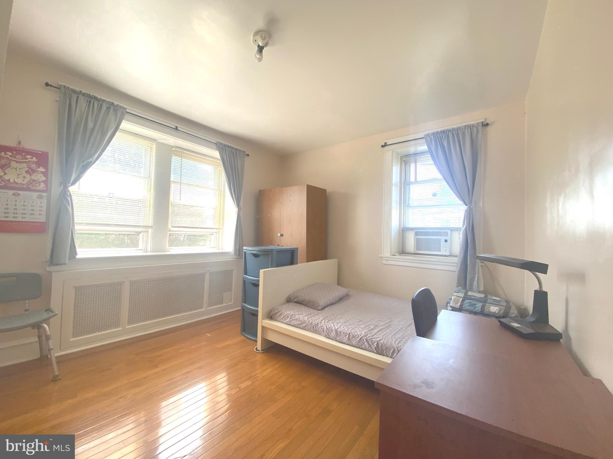 2249 Knorr Street Philadelphia, PA 19149 - Photo 29 of 40 a living room with a bed furniture and a large window