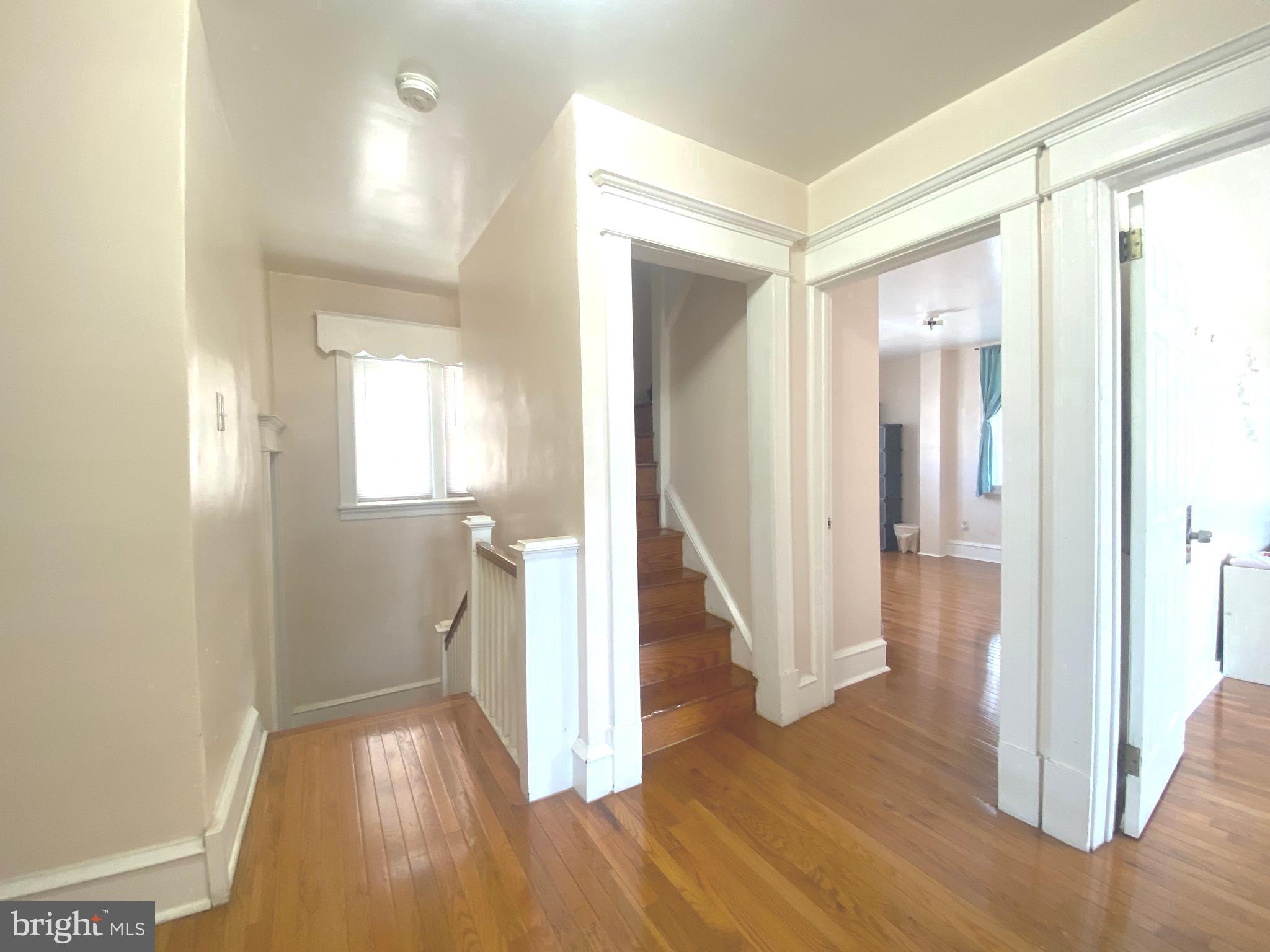 2249 Knorr Street Philadelphia, PA 19149 - Photo 31 of 40 a view of a hallway with wooden floor and staircase