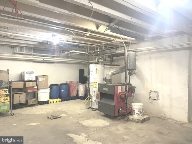a view of a hallway with wooden floor and windows